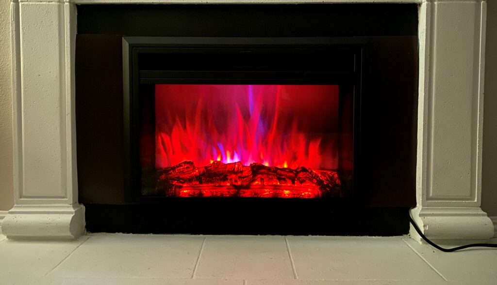 A fireplace with vibrant red and blue flames, creating a mesmerizing and colorful display in Riverside.