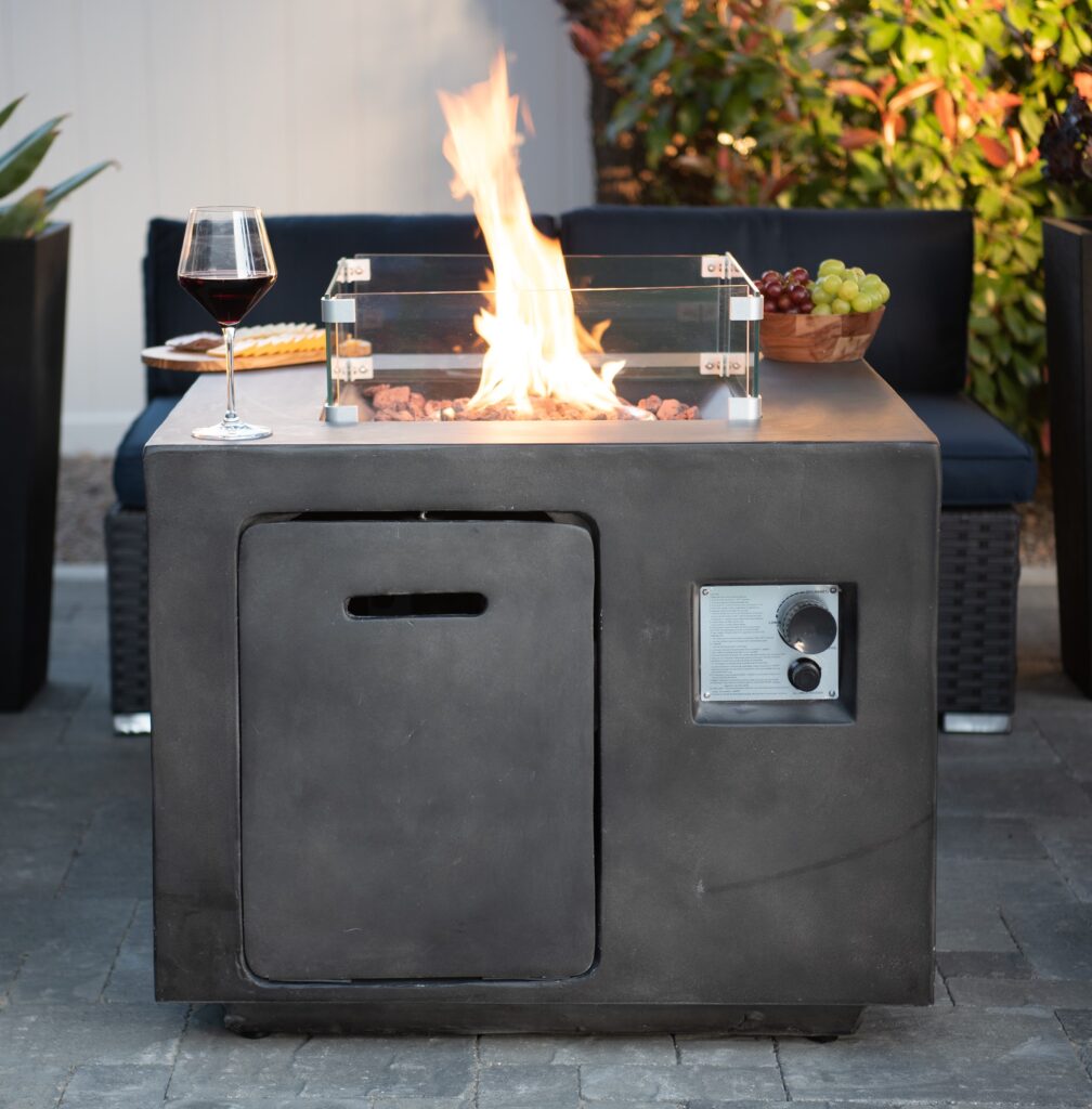A metal propane fire pit on a patio, offering a charming setting to gather around and enjoy the flickering flames in San Diego.